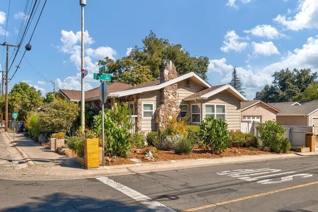 Building Photo - Welcome to this stunning 4-bedroom, 2-bath...