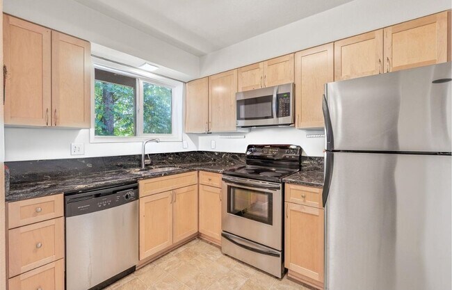 Building Photo - Spacious 2-Bedroom Condo with Forest Views, Private Balcony, In-Unit Laundry & Community Amenitie...