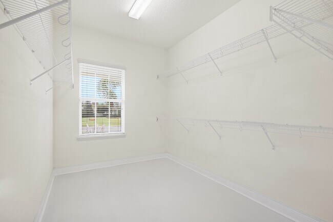 Building Photo - Spacious 6-Bedroom Home Near Lake Nona | 3-Car Garage + Tesla Charger