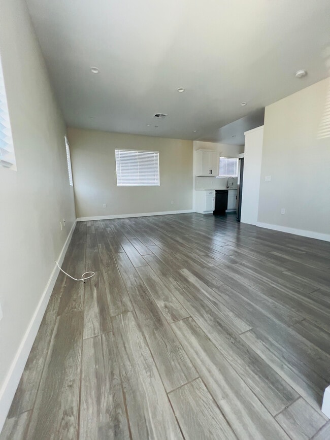 LIVING ROOM/ DINING AREA - 3928 S Normandie Ave