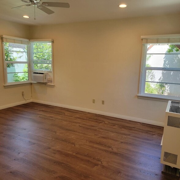 Bedroom showing wall heater and window air conditioner and 3 of the 5 windows - 1331 Barrington Way