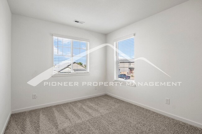 Building Photo - Modern 4-Bed, 2.5-Bath Home with 2 car garage, AC and Private Enclosed Yard