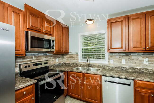 Building Photo - Lease today! No extra charge for contentme...
