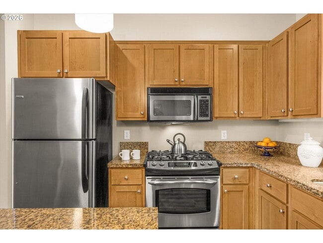 Building Photo - Main Street Living with Granite Kitchen, Gas Fireplace, and MAX Line Access