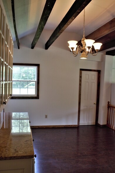 Newer window at north side of dining room. Door leads off to lower bedroom with walk-in closet. - 9331C Tallmadge Road