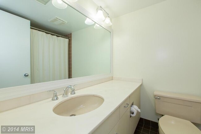 Building Photo - A one bedroom, one and one half bath conte...