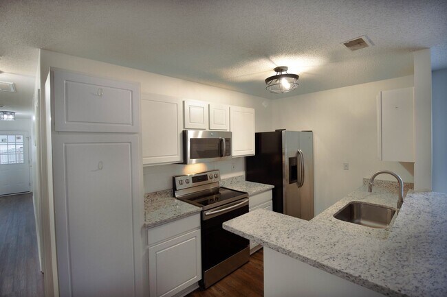 Building Photo - Recently Updated, and a FENCED Backyard!
