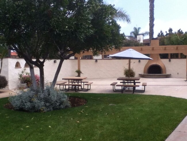 Building Photo - Beautiful Townhome with large fenced back patio, second story balcony, and two covered parking spots