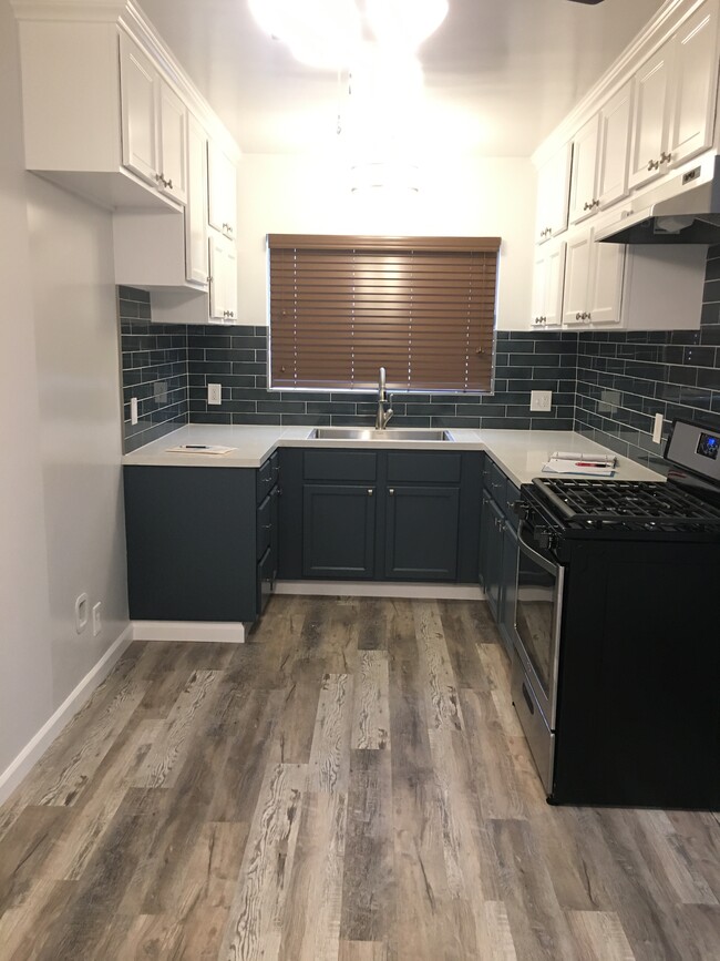 Remodeled Kitchen with vinyl plank flooring - 1016 Western Ave