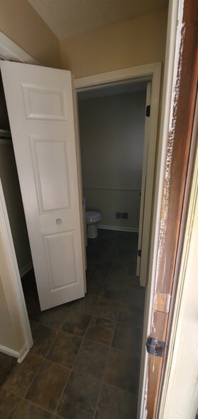 Foyer to half bath view - 1110 Timbercreek Dr