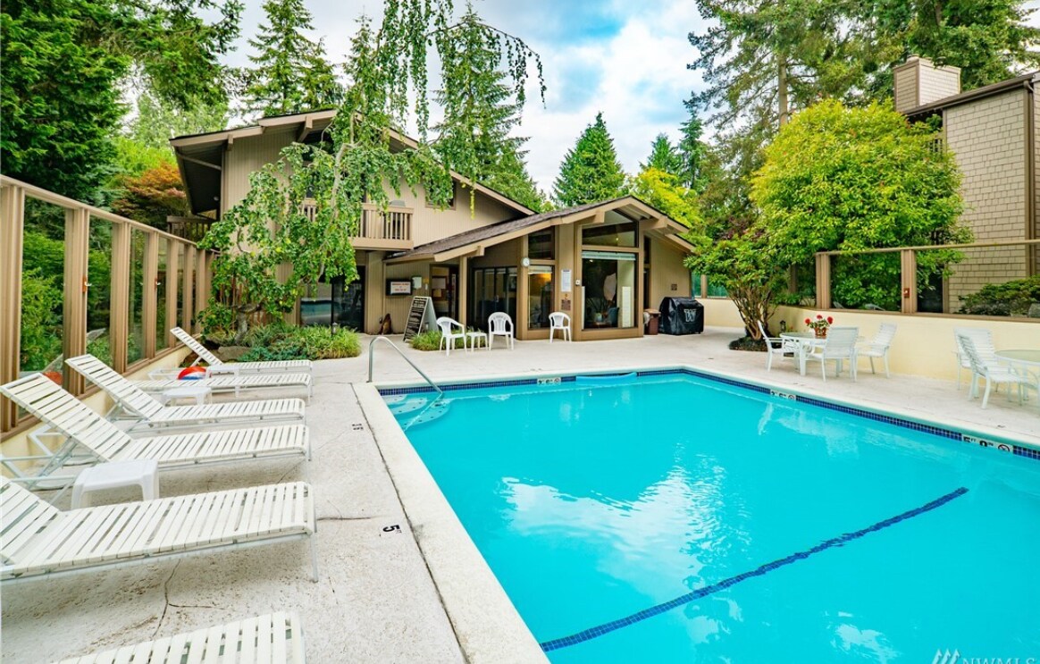 Outdoor pool with clubhouse - 13730 15th Ave NE