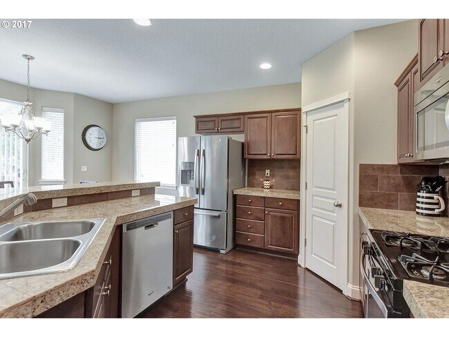 Building Photo - Bright and Open Floor Plan with Fireplace, Attached Garage & Vaulted Ceilings