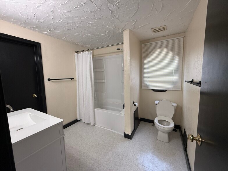 Upstairs bathroom and door to storage - 339 Power St