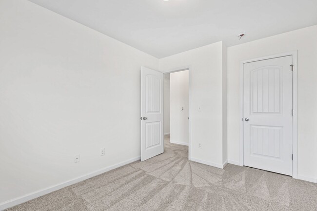 Building Photo - Spacious 4-Bedroom End-Unit Townhome in a ...