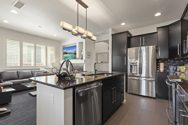 View of kitchen and open floor plan - 8935 E Phillips Dr