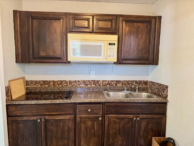 Building Photo - Move In Special: Half off the first month's rent with a 14-month lease.  Updated Rear Unit