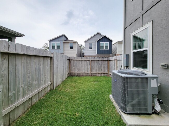 Building Photo - A true gem on a quiet corner lot, this spacious and sun-filled home is tucked away from street no...