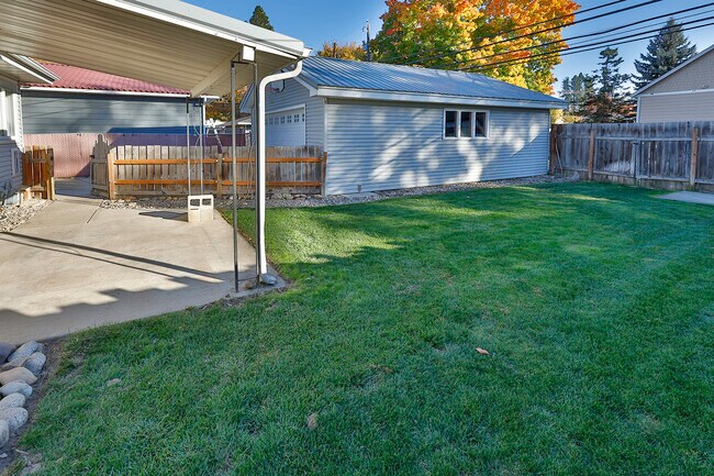 Fenced in backyard with sprinkler system - 1020 E Garden Ave
