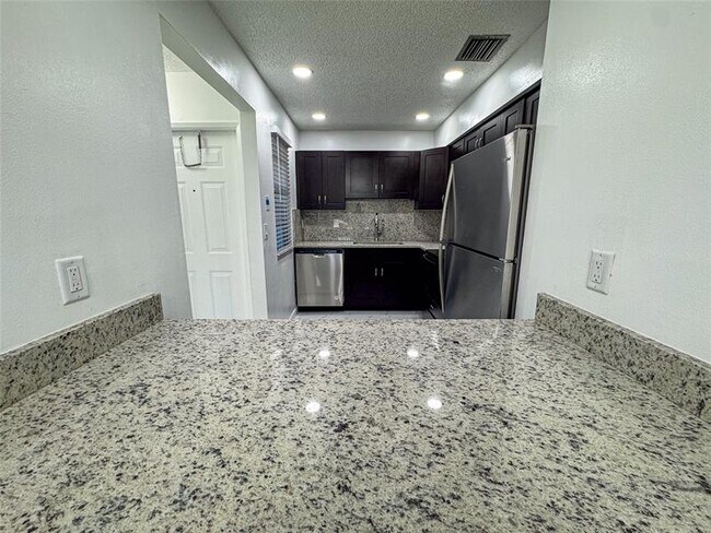Building Photo - 10687 Royal Palm Blvd