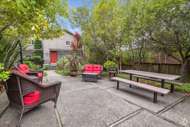 Common Area with Outdoor Seating and Table - Via Holon Apartments