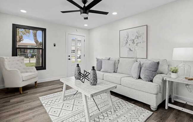 There is a lot of natural light in the living room. - 5401 Burton Ln