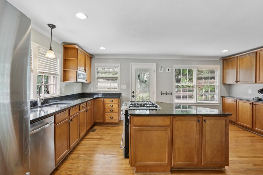 Large kitchen, tons of natural light and storage. - 781 Rosedale Ave SE