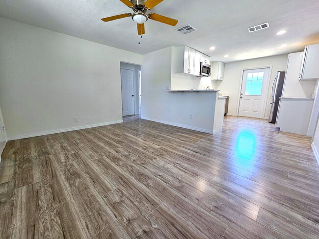 Building Photo - fully renovated 2-bedroom, 1-bathroom home with bonus guest room or office and oversized fenced yard