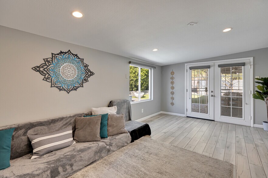 Arizona room off the kitchen, styled as a flexible bonus living space with outdoor flow - 6136 N 9th St