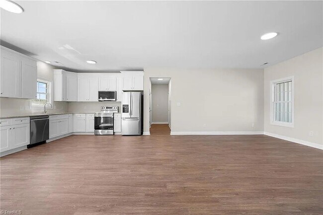 Building Photo - Earn Wealth While Leasing - Like a Homeown...