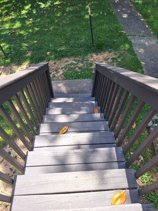 Building Photo - Cute white cottage with white picket fence & Huge deck off back door!