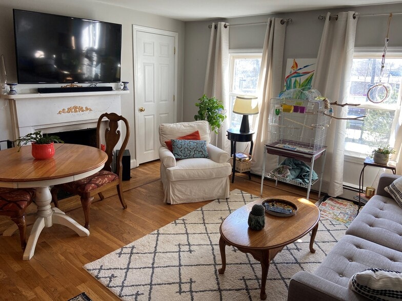 sun-filled living room with cozy fireplace - 19 Railroad St