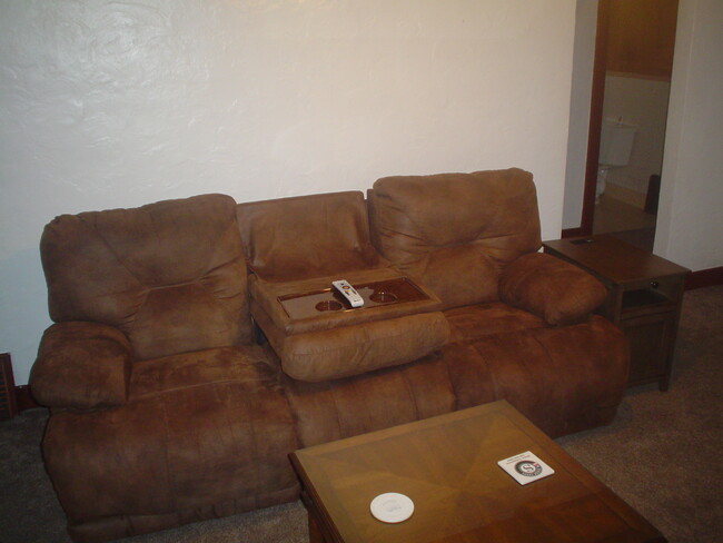 Double reclining sofa. - 714 Main St