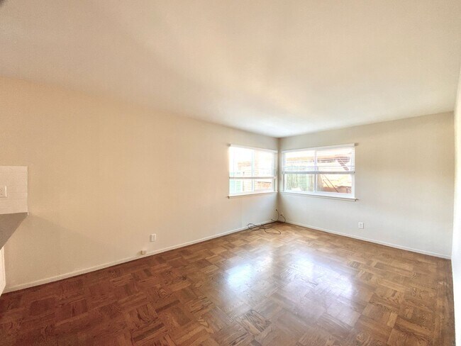 Building Photo - REMODELED KITCHEN! Storage, Parking Available, On-Site Laundry!