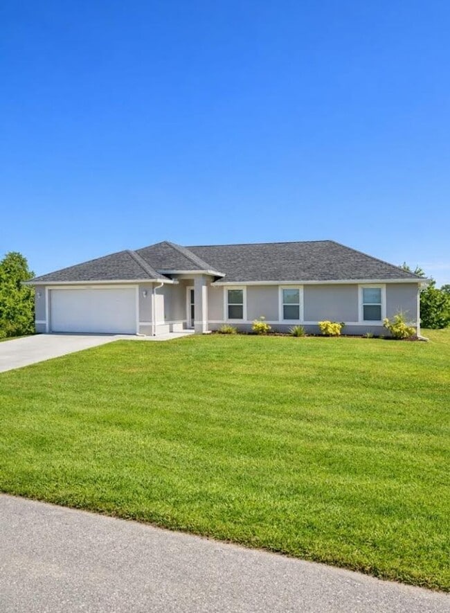 Building Photo - Spacious Three-Bedroom Home with Open Floor Plan, Large Yard & Screened Patio