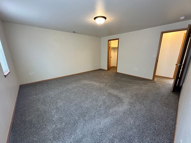 Building Photo - 4 Bedroom 3 Bathroom Home with Attached Garage, AC, and 2 Separate Living Areas!