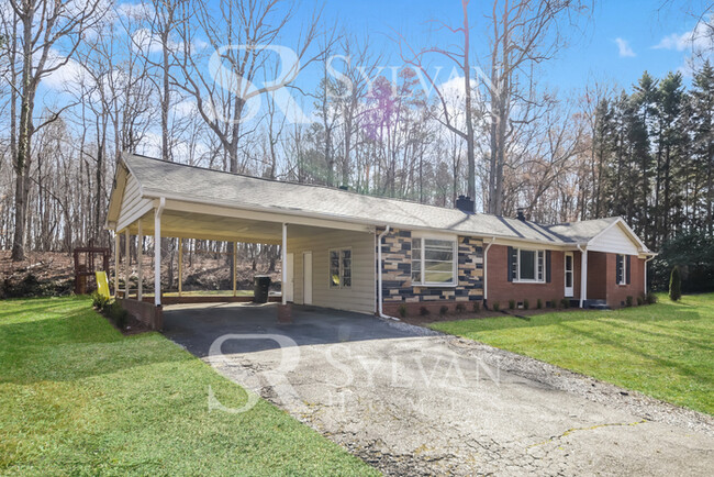 Building Photo - Nice brick home with beautiful curb appeal