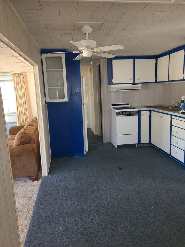 Building Photo - 55+ mobile home community. On canal to bea...