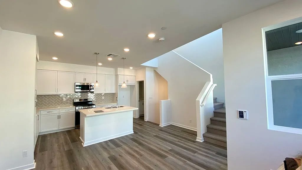 Living room and kitchen no furniture - 9610 New Morning Pl