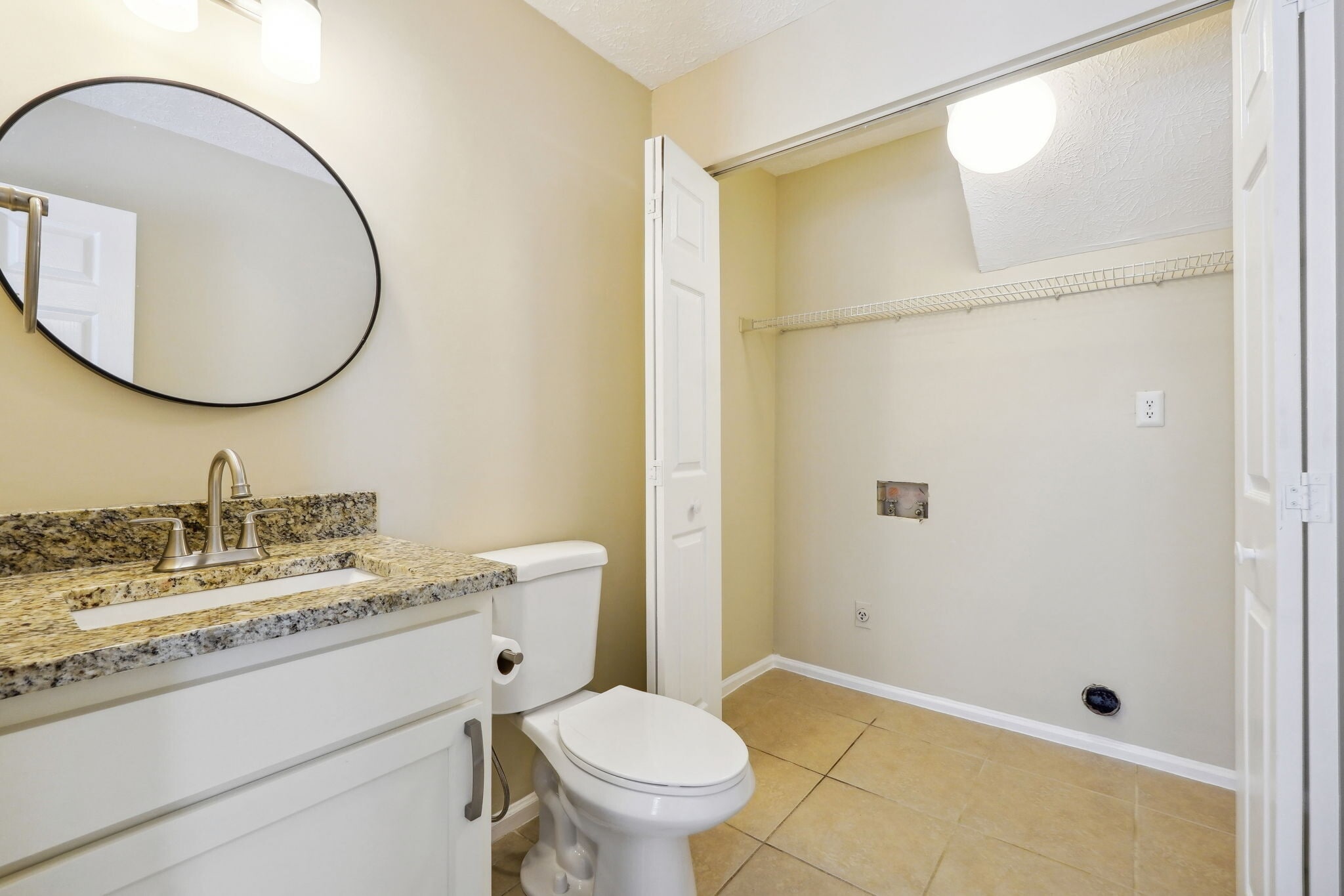 Laundry closet and halfbath off kitchen - 7016 Grinder Drive