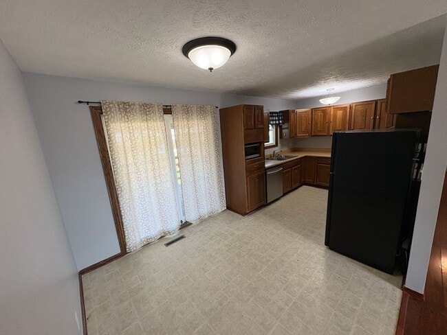Building Photo - Spacious Single-Family Home with Fenced Backyard & Attached Garage