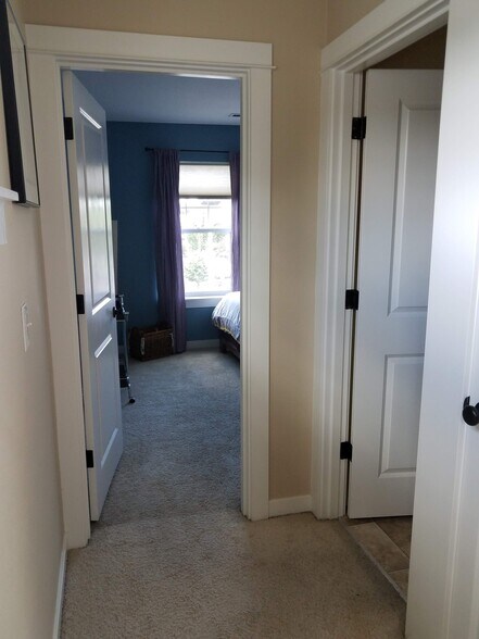 Entrance to the 3rd bedroom, down the hallway. - 7727 N Kellogg St