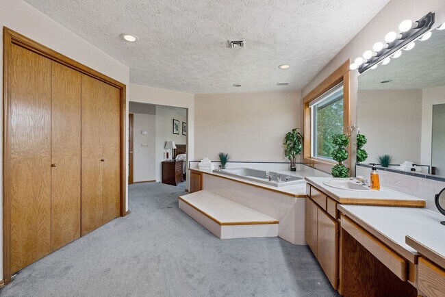 Building Photo - Stunning Home and Three Bay Shop Along Spo...