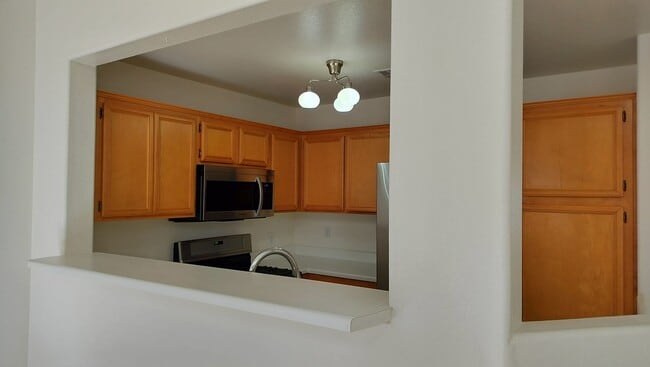 Building Photo - Townhome with Loft + Two Bedrooms/Baths - Designed for Comfort in Gated Community