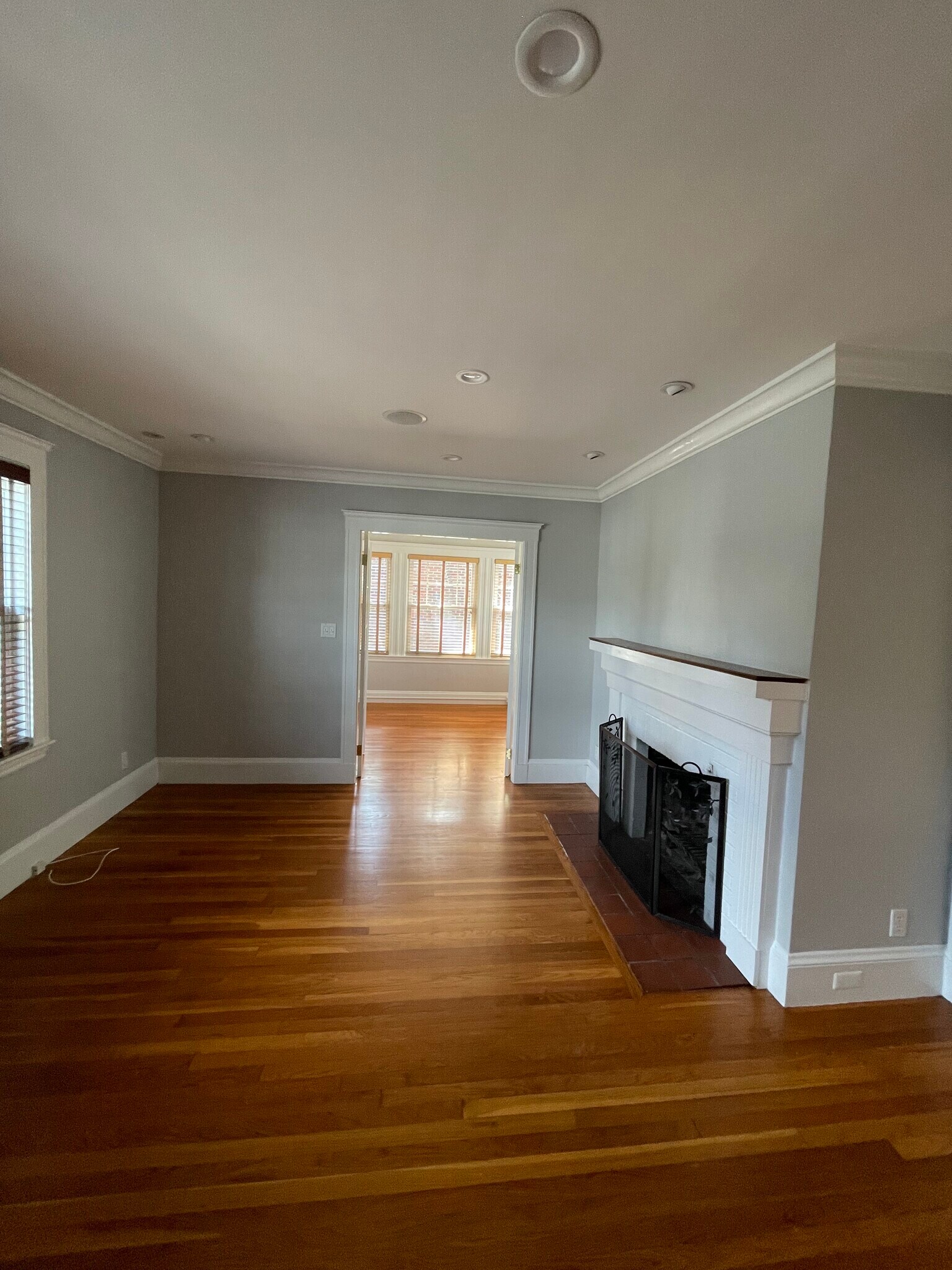living room wood burning fireplace - sunroom at the end - 36 Gerald Rd