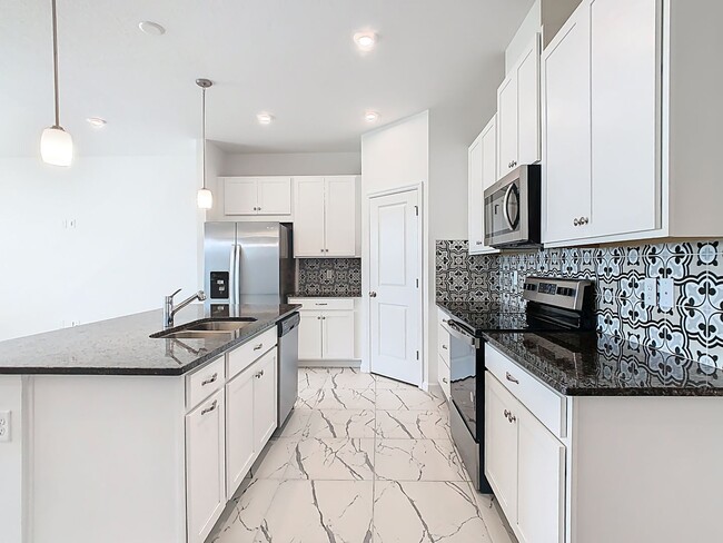 Building Photo - JUST REDUCED! PET FRIENDLY! Experience Com...