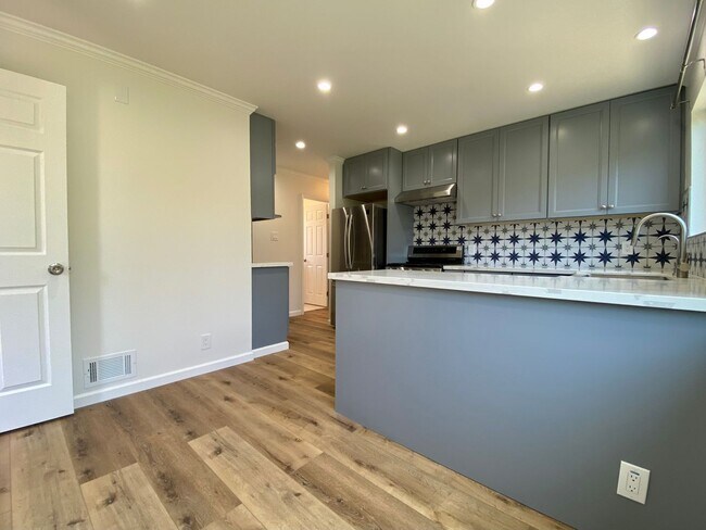 Building Photo - Remodeled 3BR, 2BA with Orchard, Garage & ...