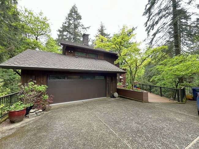 Building Photo - One-of-a-Kind Custom Home with Wall of Windows, Stone Fireplaces, Expansive Entertainment Space &...