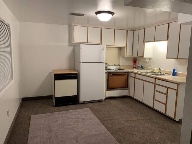 Kitchen includes a portable dishwasher. - 512 29th Ave NE