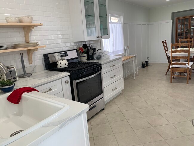 kitchen with Subway tile and Wainscotting. - 3632 Dunn Ave