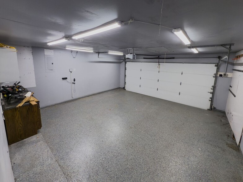 2-car garage with epoxy flooring and overhead lighting - 2006 Candle Ct